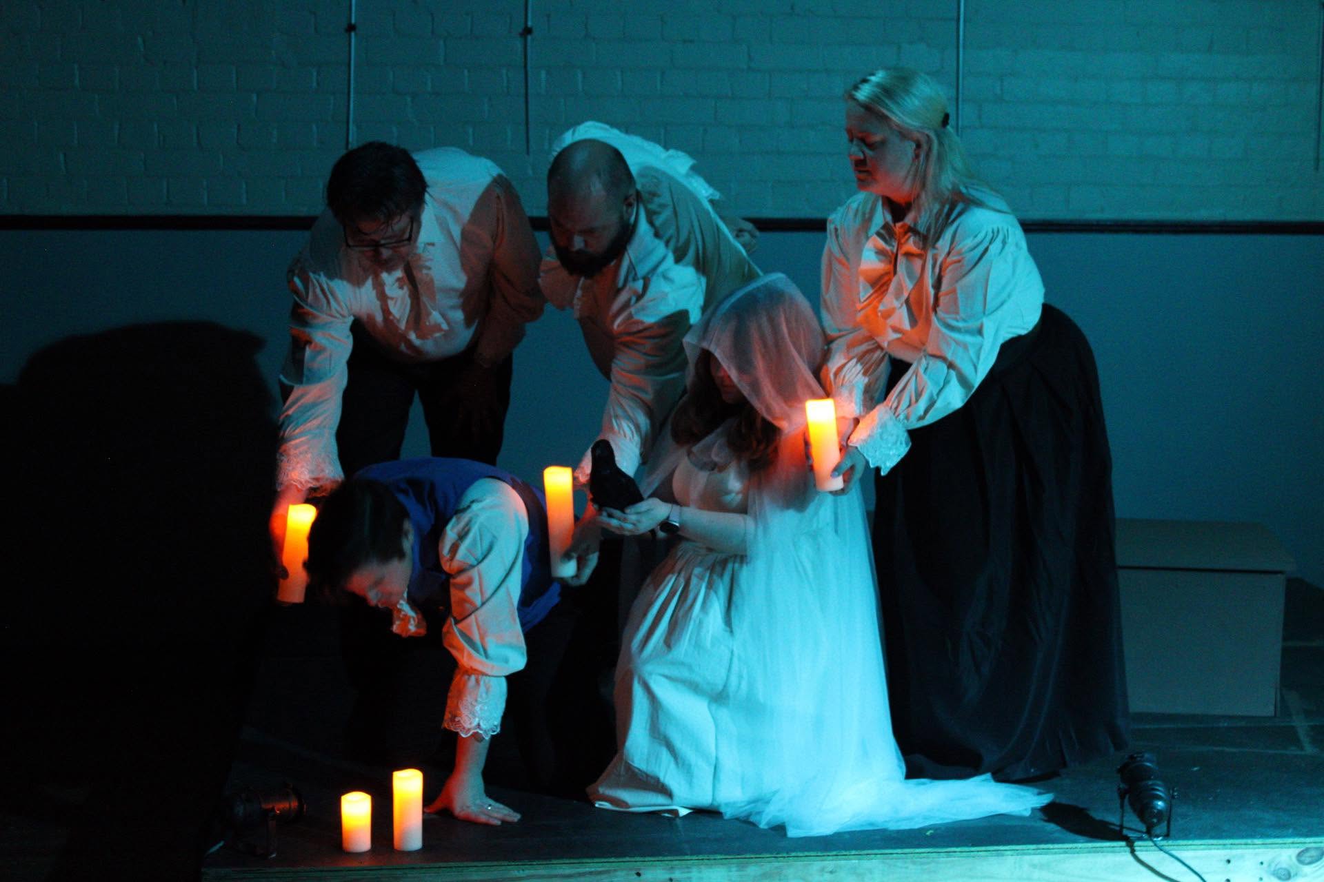 A candlelit ritual on stage